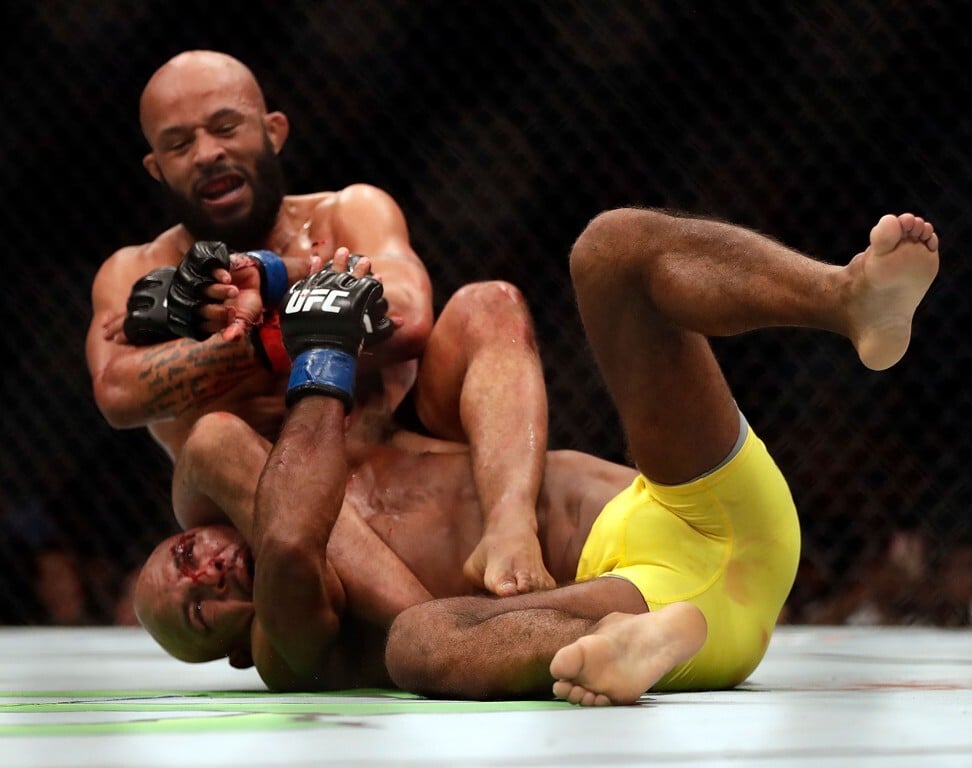 Demetrious Johnson takes down Wilson Reis during their UFC flyweight title bout on April 15, 2017 in Kansas City, Missouri. Photo: AFP