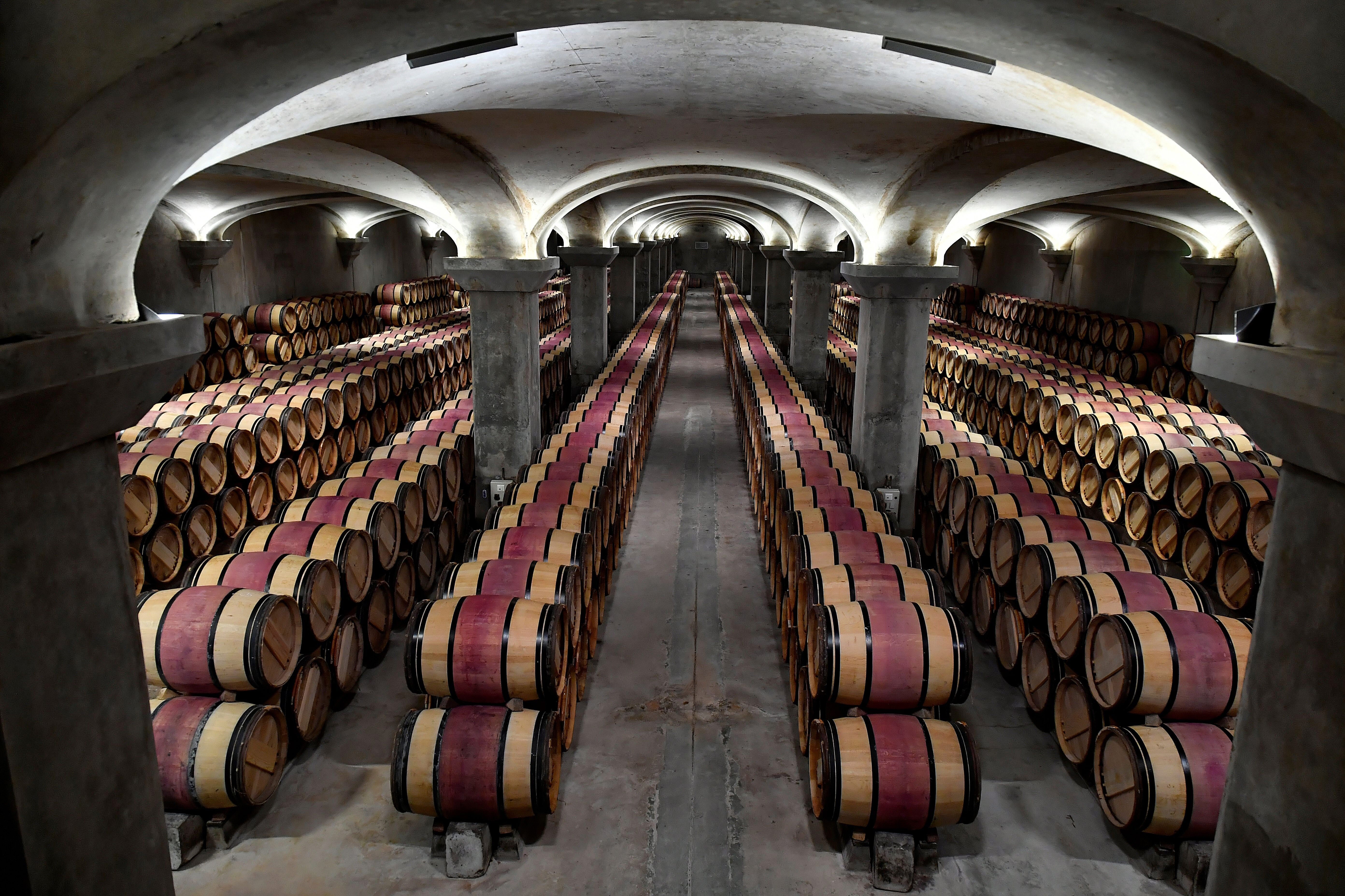 Wine casks stored in a wine cellar in Margaux, near Bordeaux. Prices of fine Bordeaux wines have jumped in the past year. Photo: AFP/Getty Images
