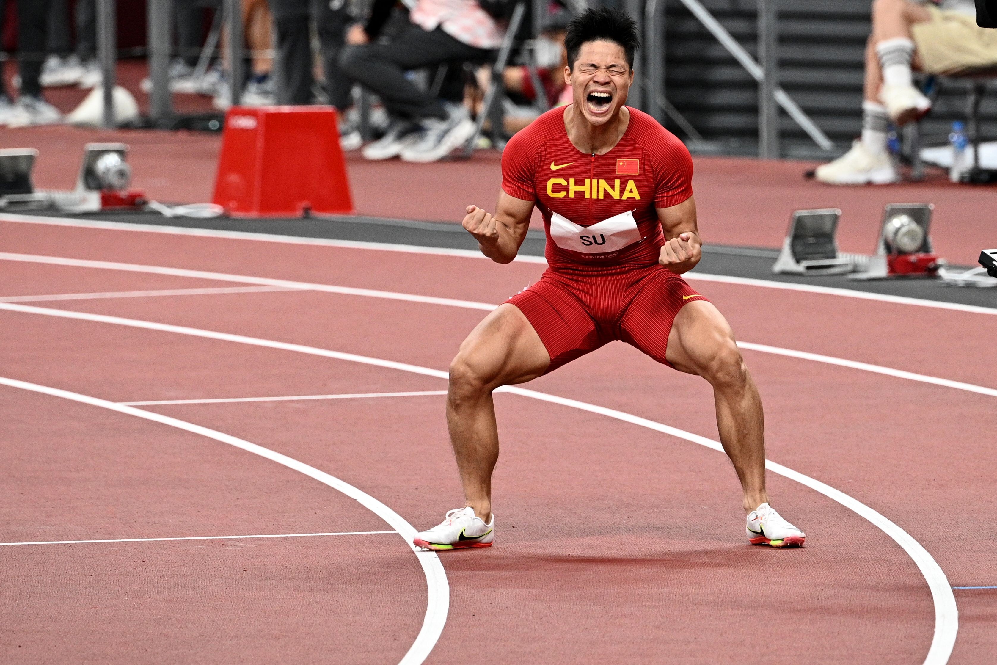 China's Su Bingtian celebrates after winning the men's 100m semi-finals during the Tokyo 2020 Olympic Games at the Olympic Stadium in Tokyo. Photo: AFP