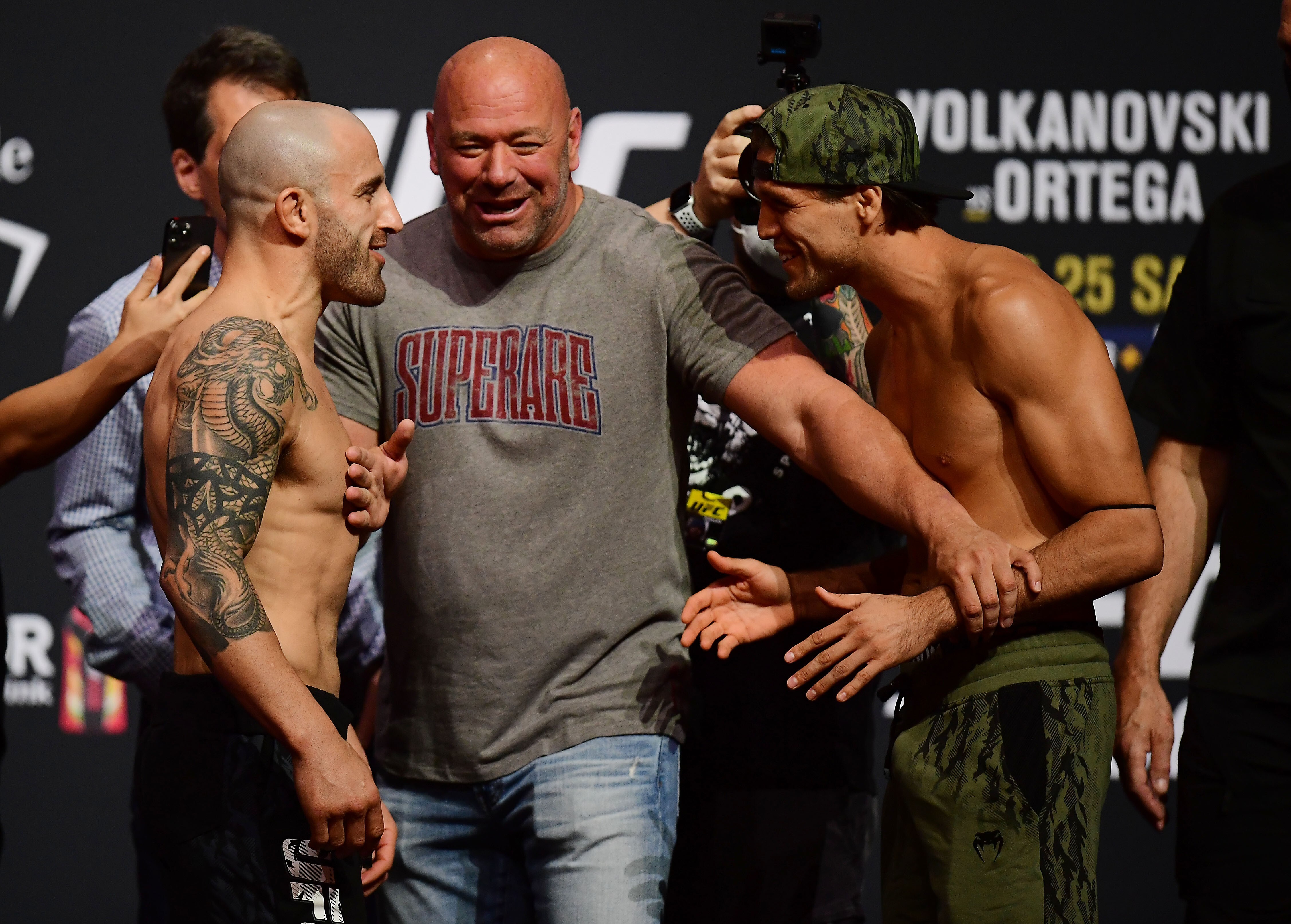 Alex Volkanovski and Brian Ortega meet face to face as UFC president Dana White separates them during weigh-ins for UFC 266. Photo: USA TODAY Sports