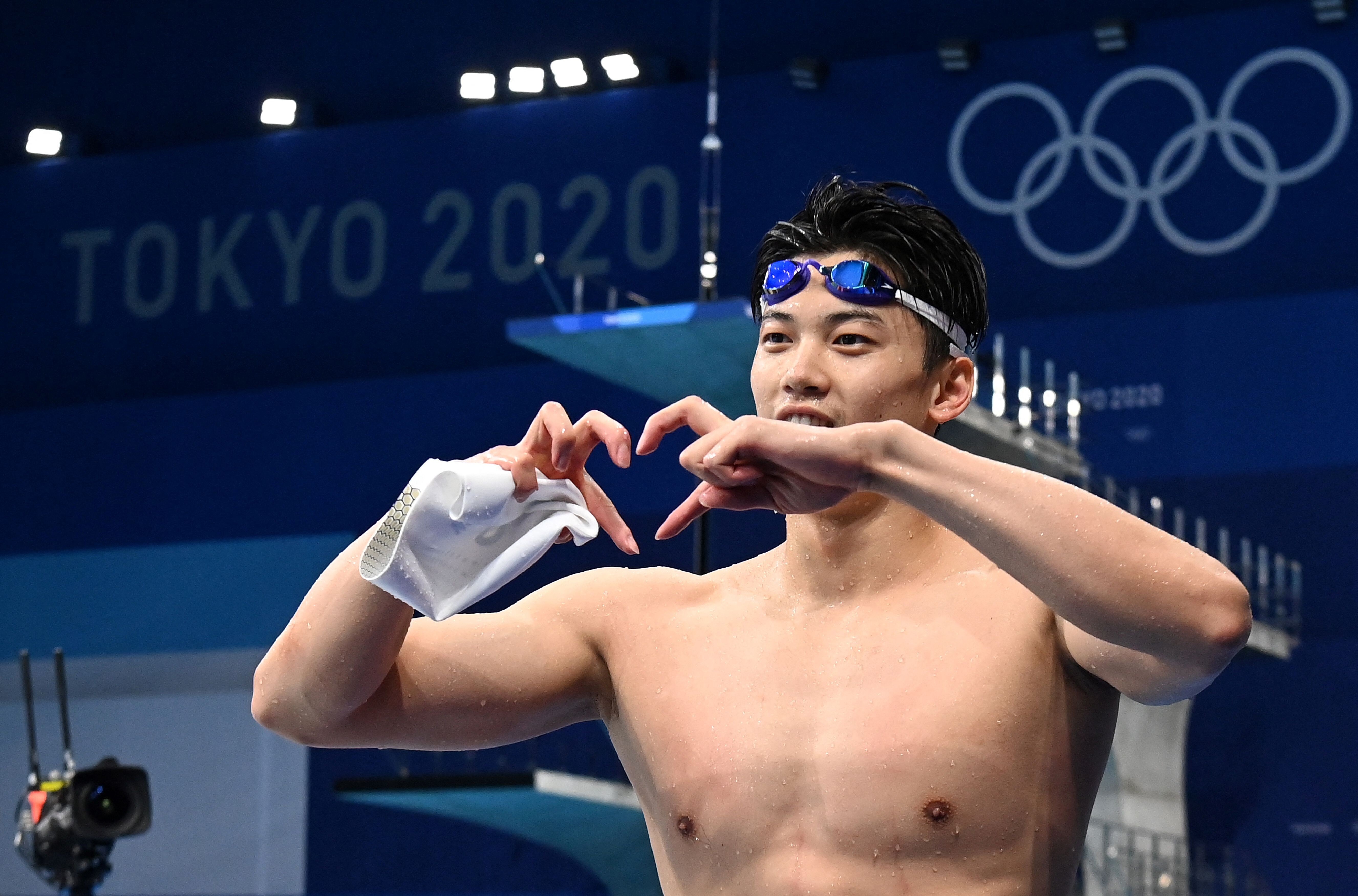 China's Wang Shun celebrates after winning the final of the men's 200m individual medley at the Tokyo 2020 Olympic Games. Photo: AFP