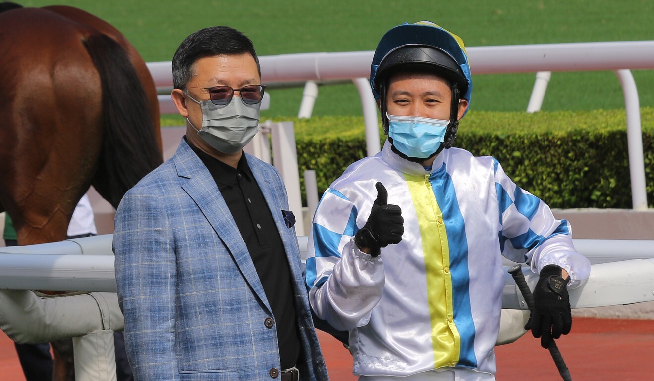 Trainer Peter Ho and jockey Alex Lai celebrate The Best Hero’s victory.