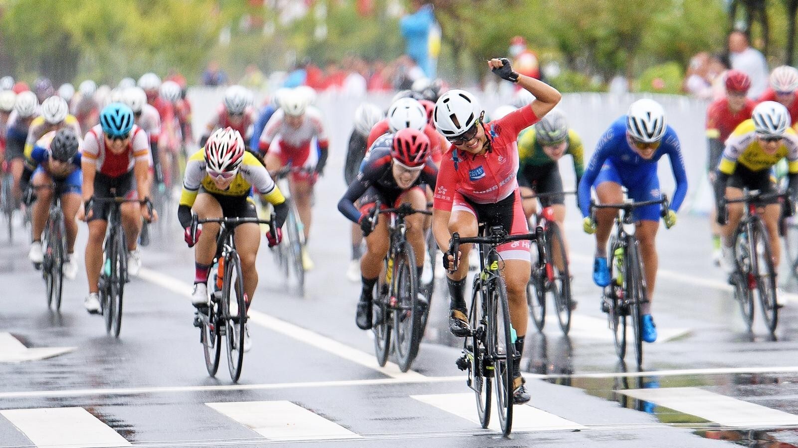 Hong Kong's Lee Sze-wing wins the women's road race at the China National Games. Photo: Cycling Association
