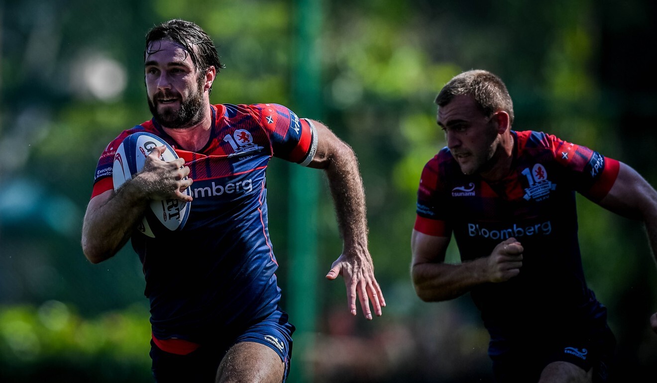 Hong Kong Scottish player Sean Taylor against Valley defence in Shek Kip Mei. Photo: Phoebe Leung