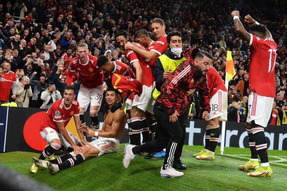 Relieved Manchester United players celebrate Cristiano Ronaldo’s late winner. Photo: EPA