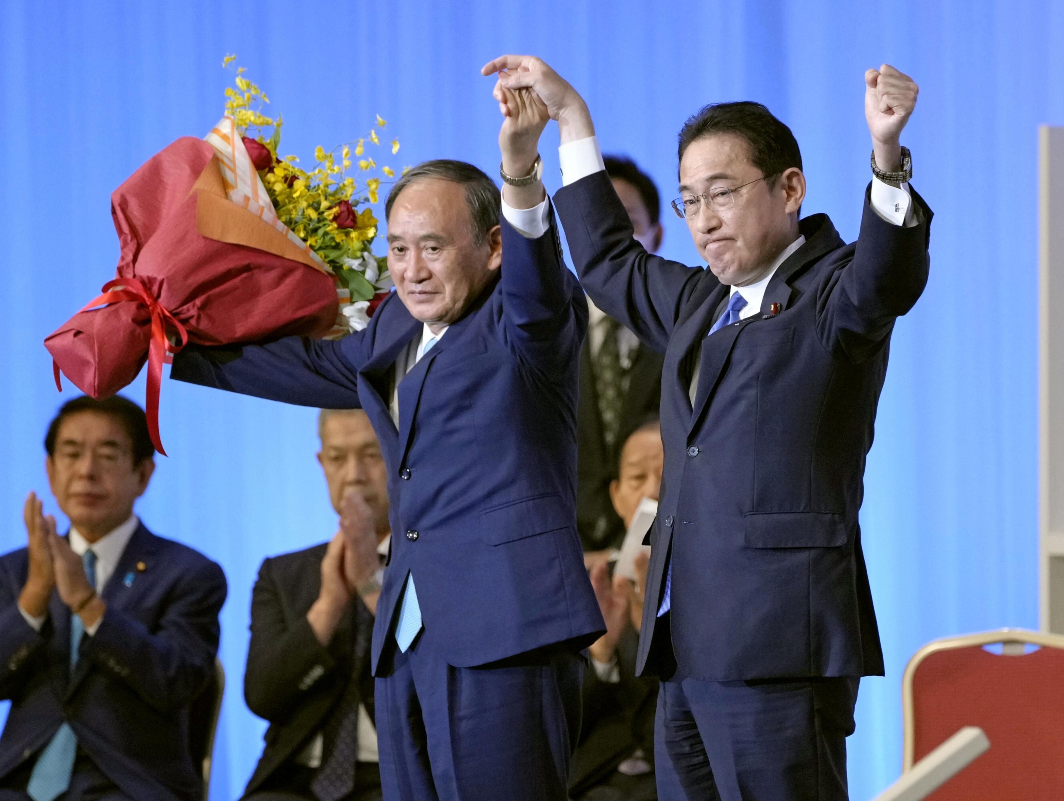 Japan's newly elected Liberal Democratic Party leader Fumio Kishida pictured with outgoing Prime Minister Yoshihide Suga. Photo: Reuters