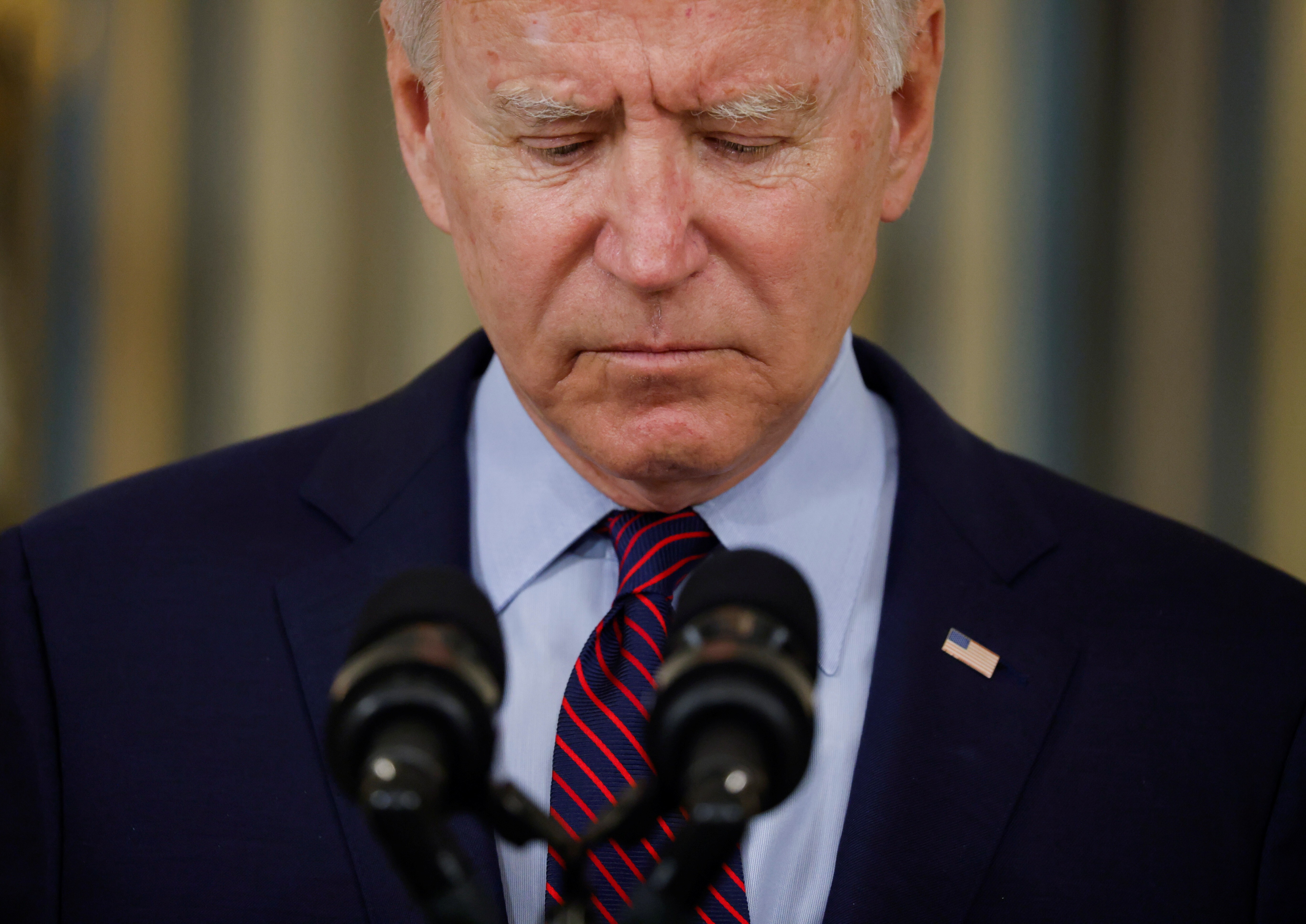 US President Joe Biden looks down as he delivers remarks on the US debt ceiling from the State Dining Room of the White House on Monday. Photo: Reuters