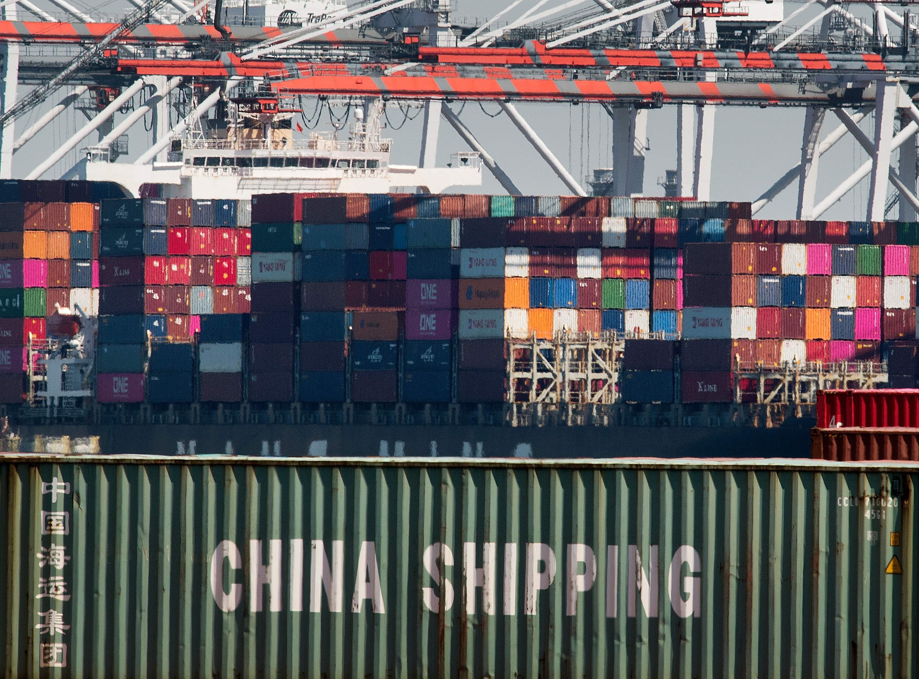 Shipping containers from China are unloaded at the Port of Los Angeles in California. A new report concludes that the country is not on a track to becoming a market economy. Photo: AFP