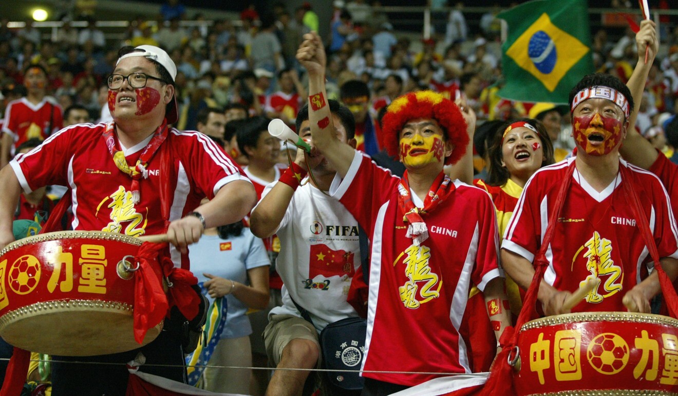 Chinese fans cheers from the stands at the match between Brazil and China in the 2002 Fifa World Cup. Photo: AFP