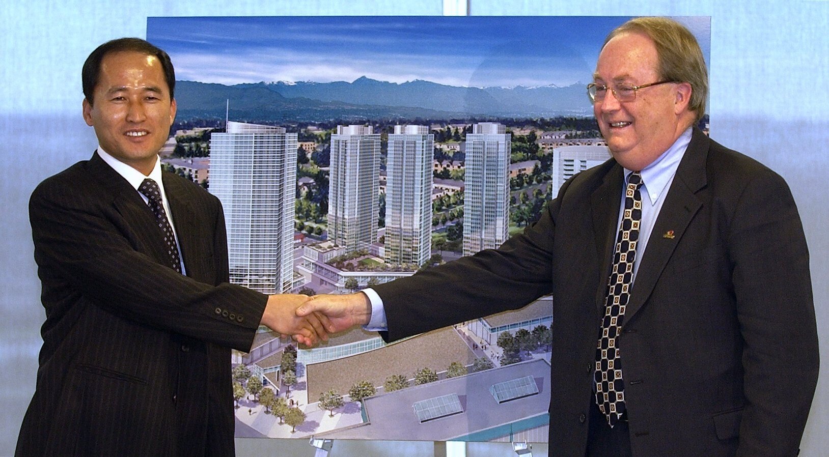 South Korean developer Jung Myung-soo is seen at the unveiling of his plans for the Central City project in Surrey, British Columbia, in 2005, with Surrey’s mayor, Doug McCallum. At the time it was to be the biggest residential and retail development in Surrey‘s history. Photo: Material republished with the express permission of Vancouver Province, a division of Postmedia Network Inc