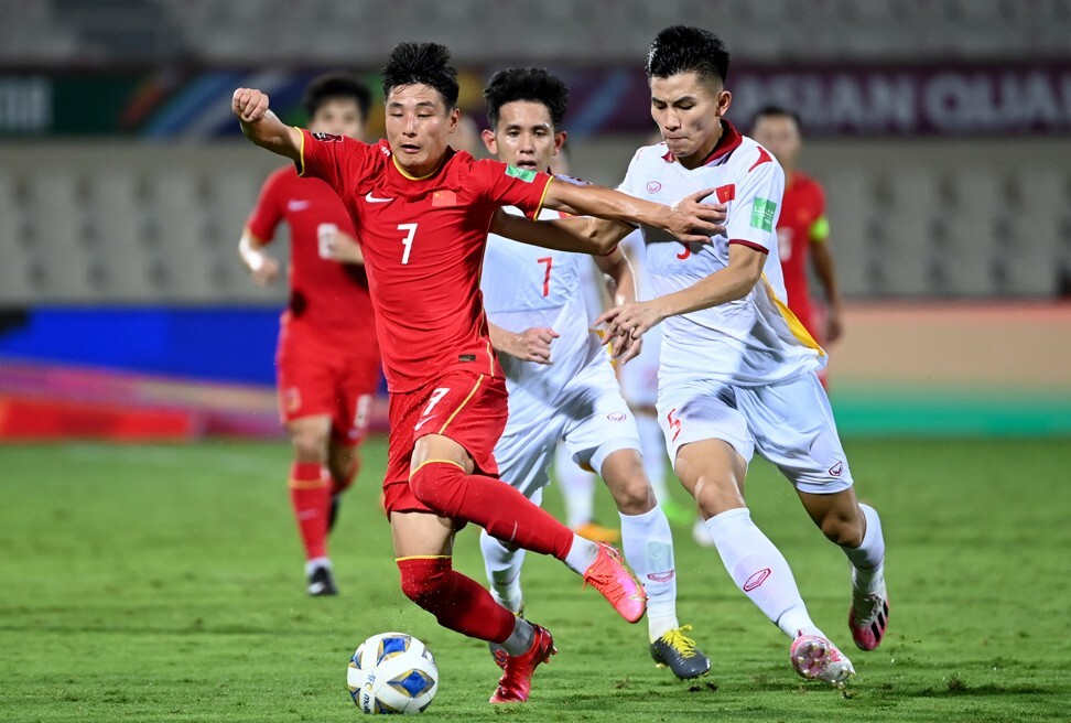 Wu Lei shields the ball from Vietnam defenders during their Fifa World Cup Qatar 2022 qualifier in Sharjah, the United Arab Emirates. Photo: Xinhua