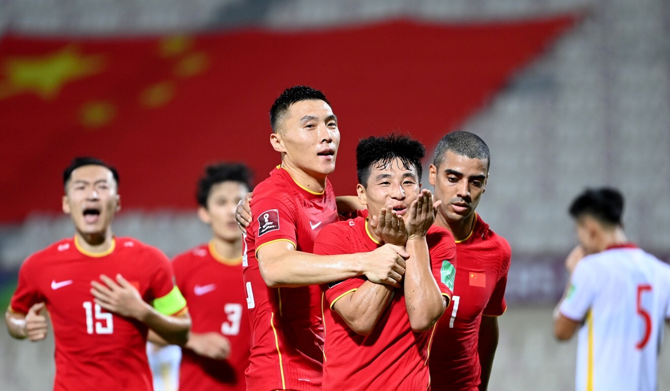 Wu Lei is congratulated by his China teammates after scoring against Vietnam. Photo: Xinhua