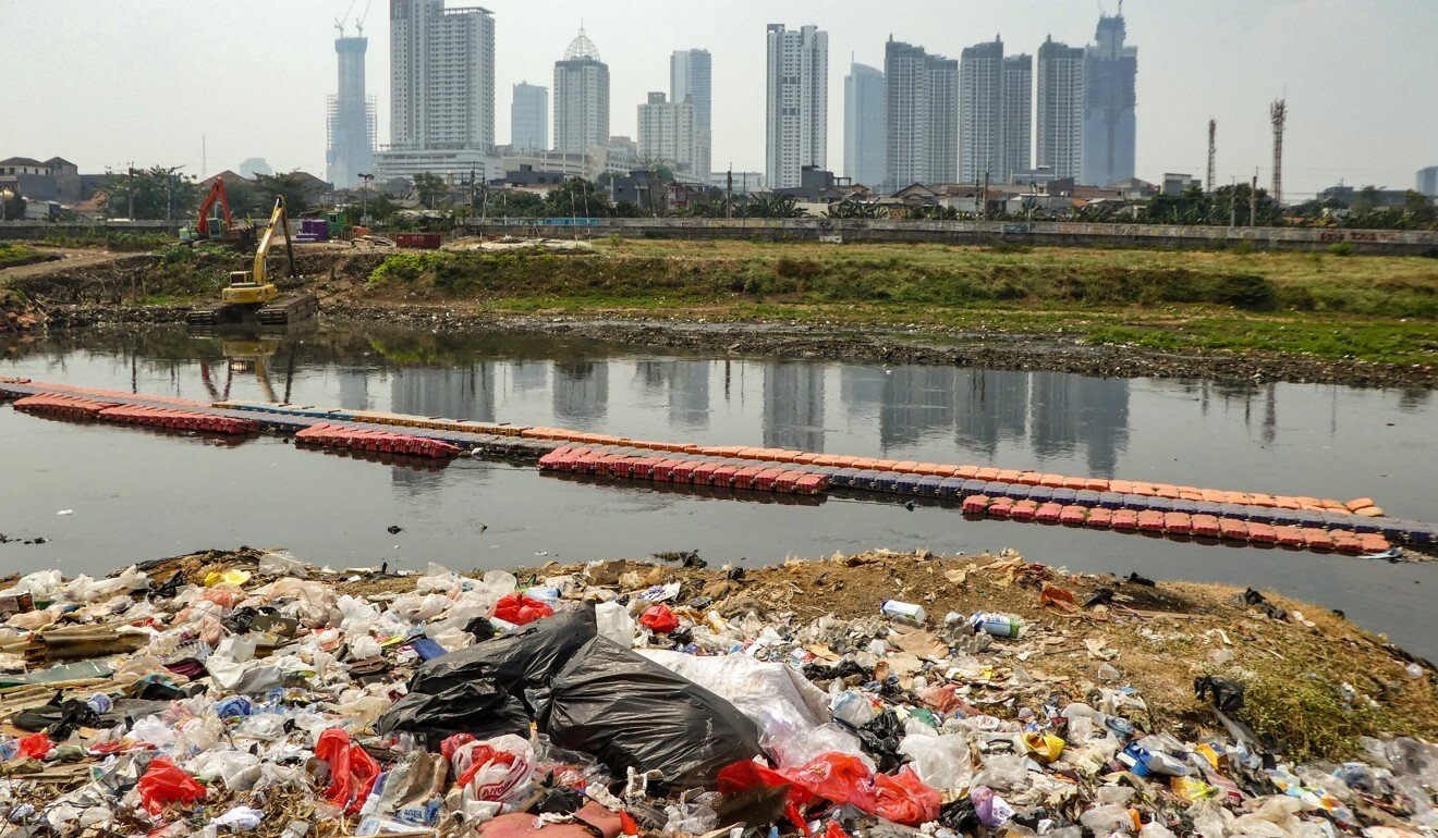 Plastic waste strewn along a river bank in Jakarta. Photo: AFP