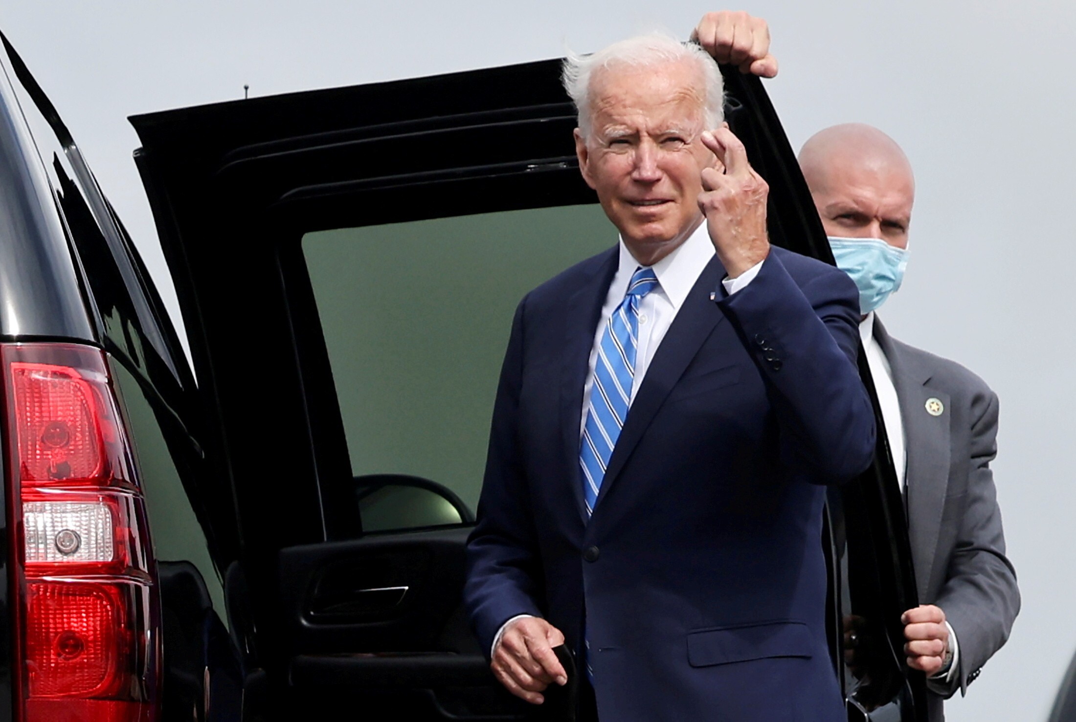 US President Joe Biden crosses his fingers as he responds to a question on October 7 about the short term US debt deal. Photo: Reuters