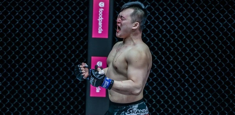 Kang Ji-won celebrates knocking out Amir Aliakbari. Photos: ONE Championship