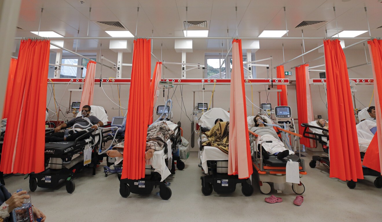 Patients lie on beds in the emergency room, turned into a Covid-19 unit due to the high number of cases, at the Bagdasar-Arseni hospital in Bucharest on Tuesday. Photo: AP