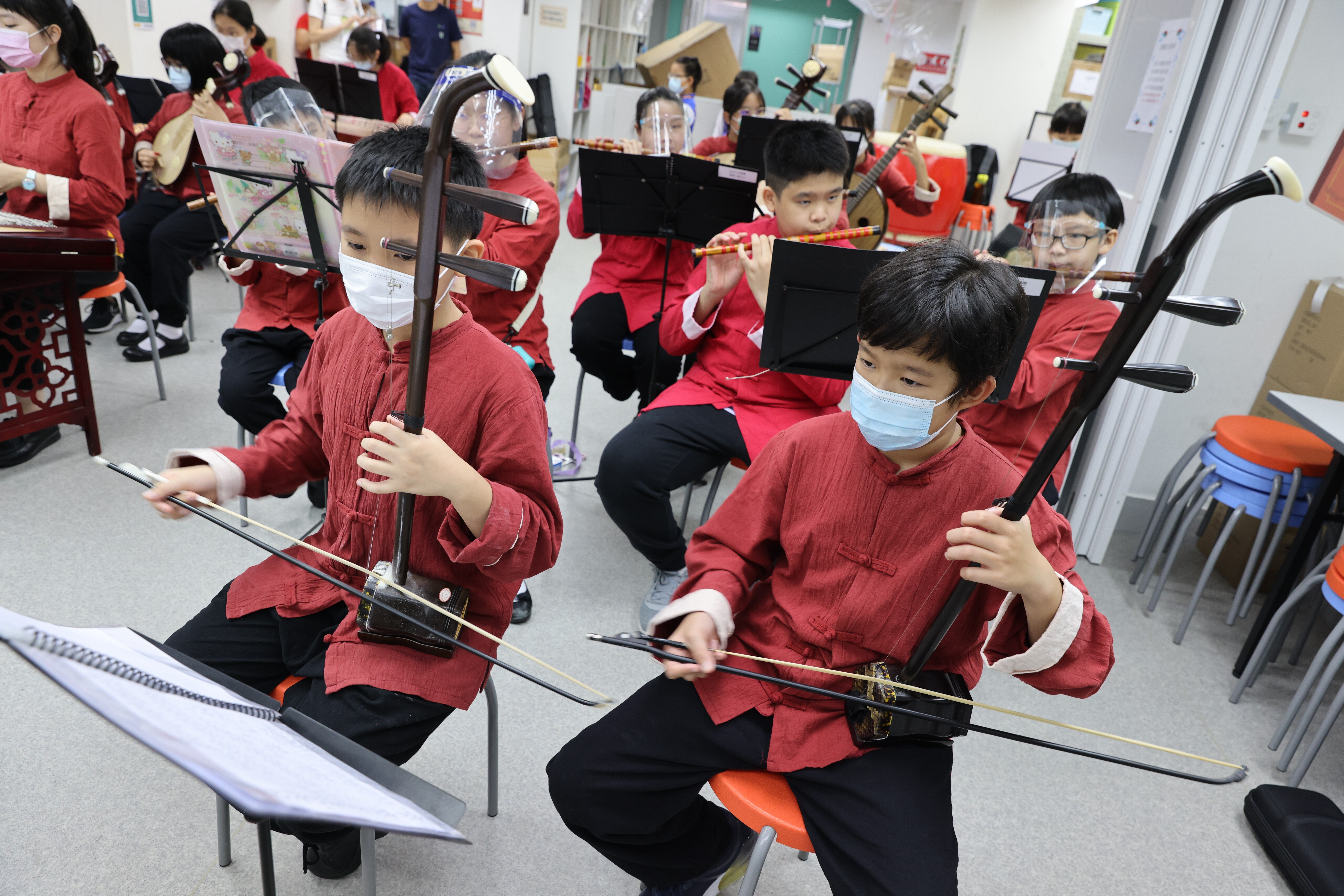 Children rehearse for a coming benefit concert being put on by the Society for Community Organisation. Photo: May Tse