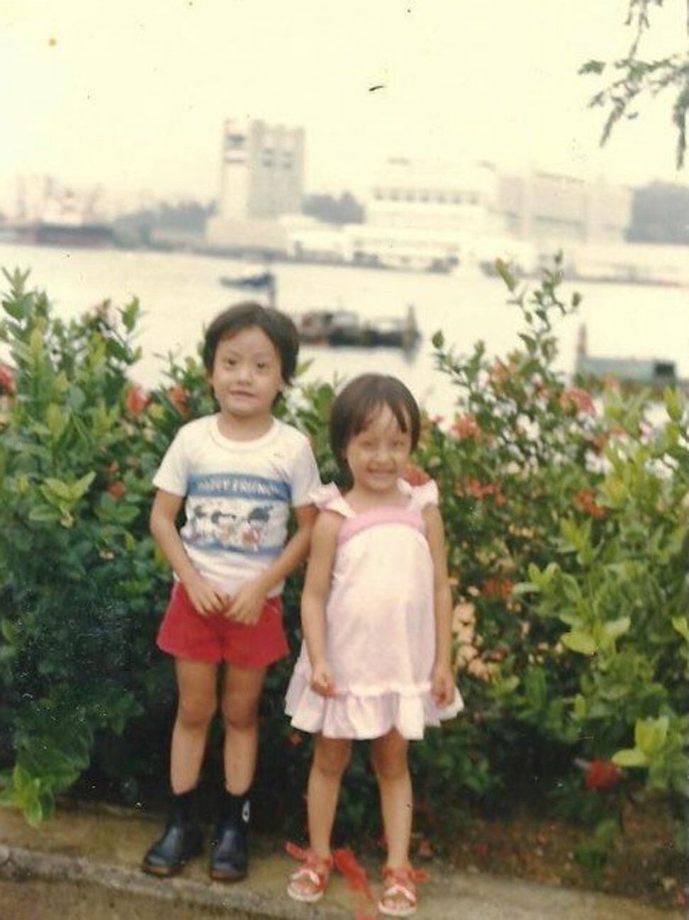 Derrick pictured visiting the sights while a refugee in Singapore. Photo: Handout