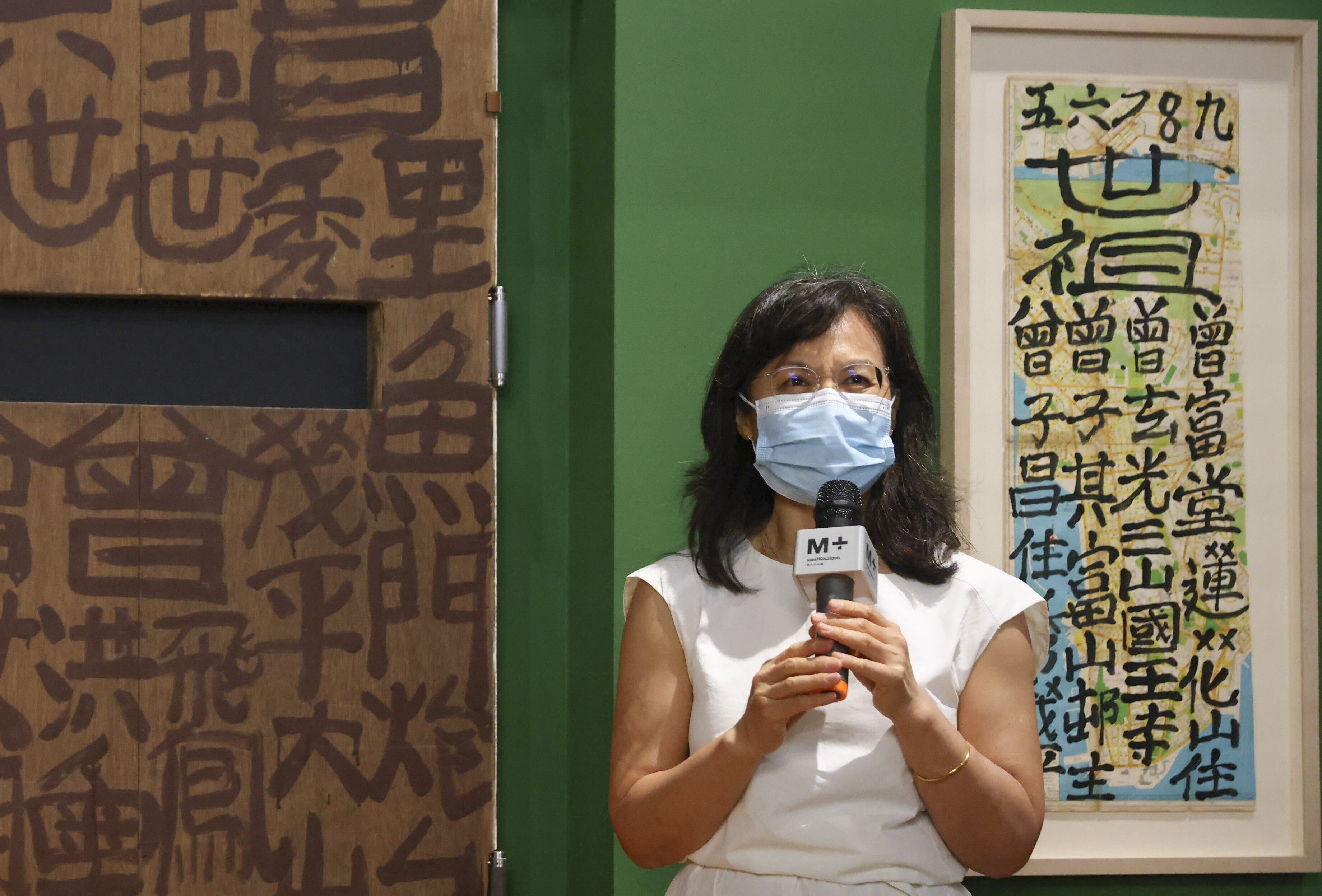 Tina Pang, curator for the Hong Kong Visual Culture at M+, introduces Doors by Tsang Tsou-choi during a preview of the museum’s Hong Kong: Here and Beyond exhibition. Photo: Nora Tam