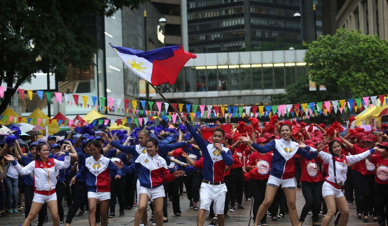 Performers dance during an event to celebrate International Domestic Workers Day in Hong Kong in 2016. Photo: AFP