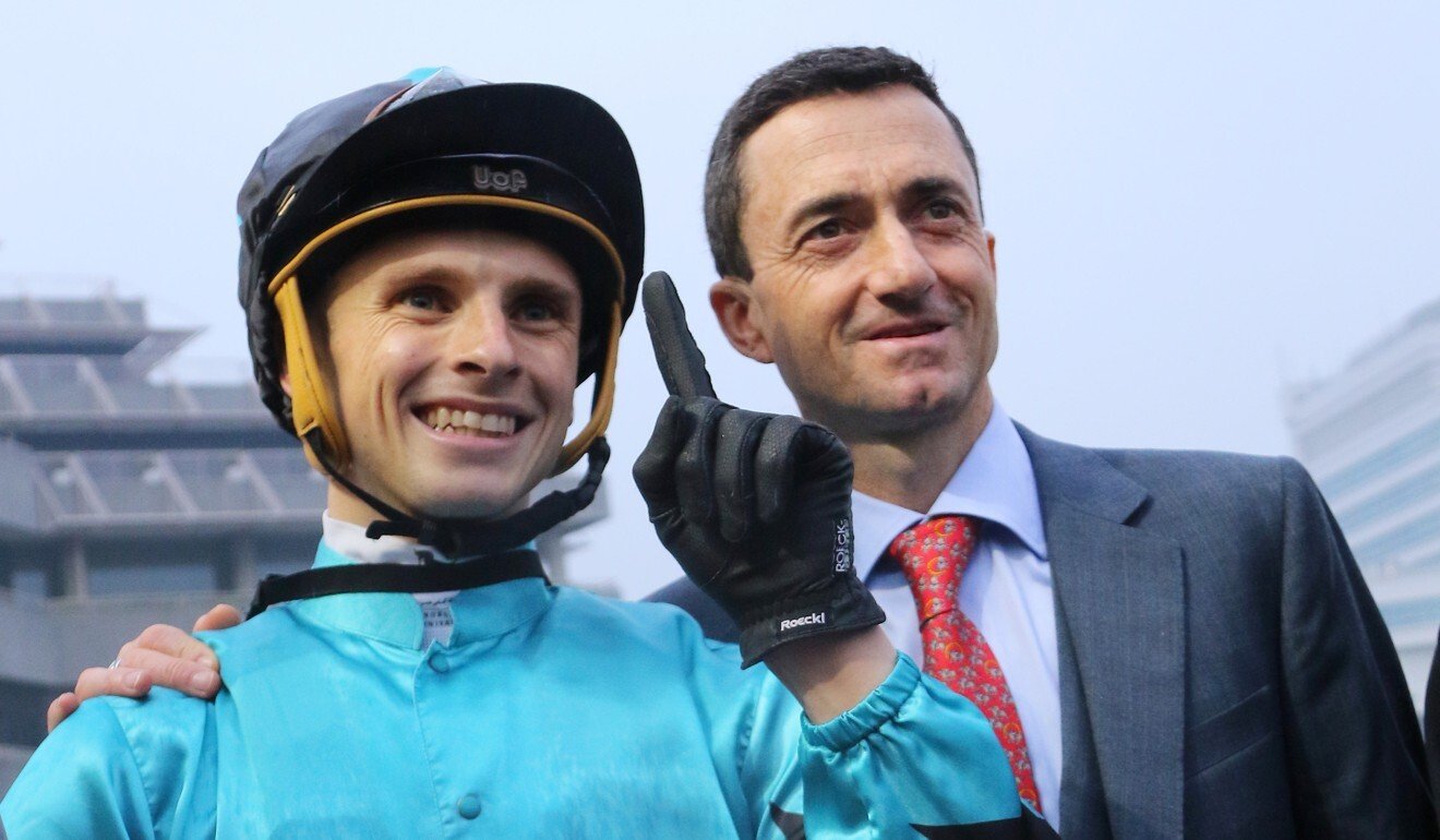 Jockey Lyle Hewitson celebrates his first Hong Kong winner with trainer Douglas Whyte.