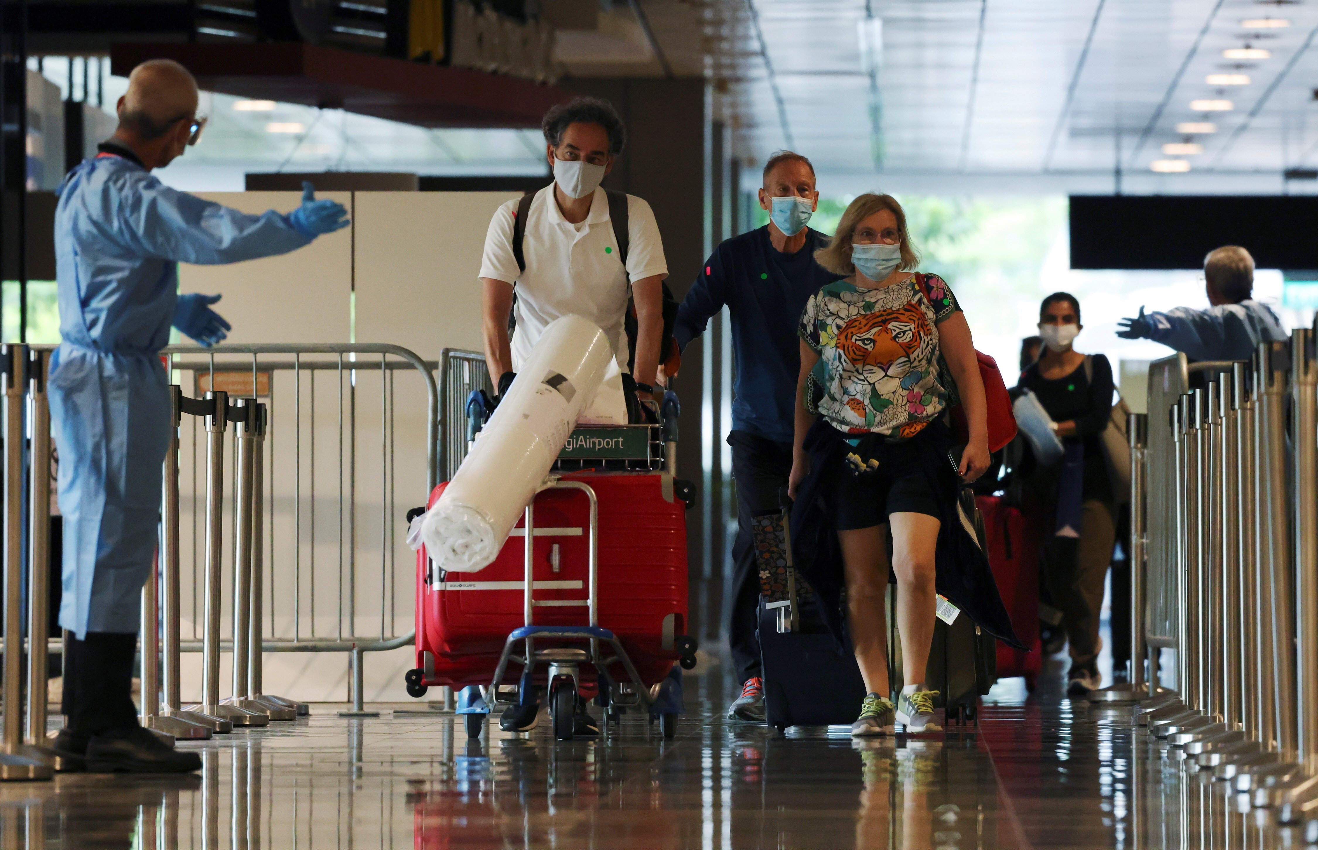 Passengers from Amsterdam arrive at Changi Airport on October 20, 2021. Photo: Reuters