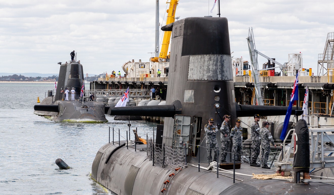 A view of an Australian Collins class submarine (front) and the UK nuclear-powered attack submarine HMS Astute (rear) at HMAS Stirling Royal Australian Navy base in Perth on Friday. Photo: EPA-EFE
