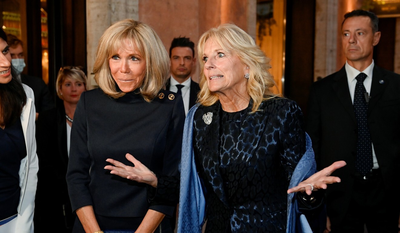 US first lady Jill Biden gestures next to French first lady Brigitte Macron as they exit the Il Marchese bar after meeting during a visit to Rome for the G20 summit on Friday. Photo: Reuters