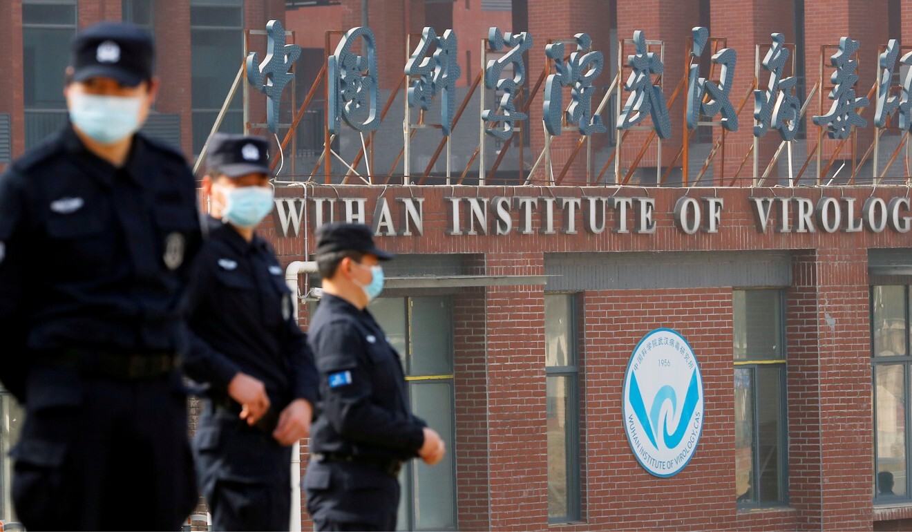 Security personnel keep watch outside Wuhan Institute of Virology during the visit by the World Health Organization team tasked with investigating the origins of Covid-19 on February 3. Photo: Reuters
