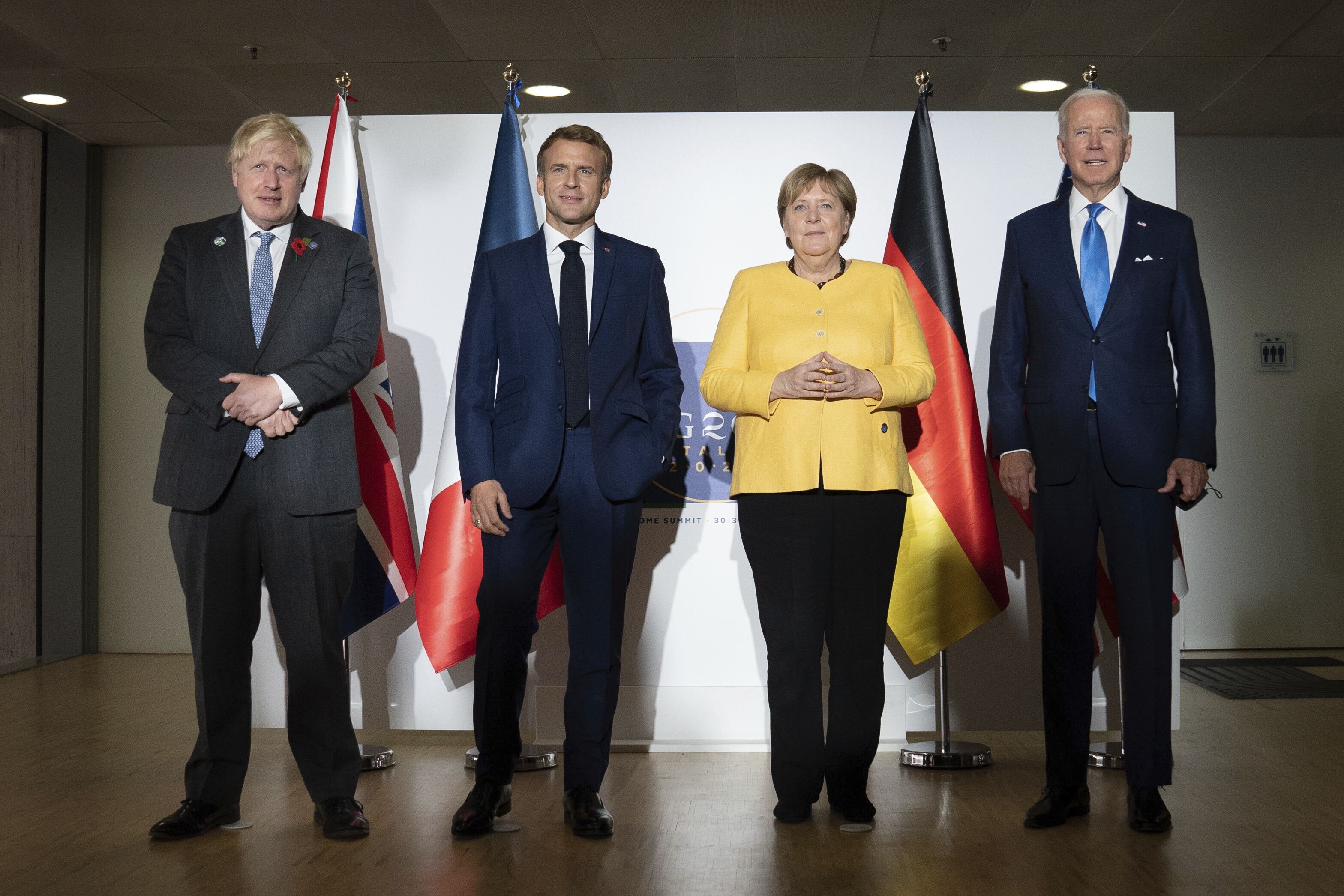 British Prime Minister Boris Johnson, French President Emmanuel Macron, German Chancellor Angela Merkel and US President Joe Biden are seen at the G20 summit in Rome. Photo: AP