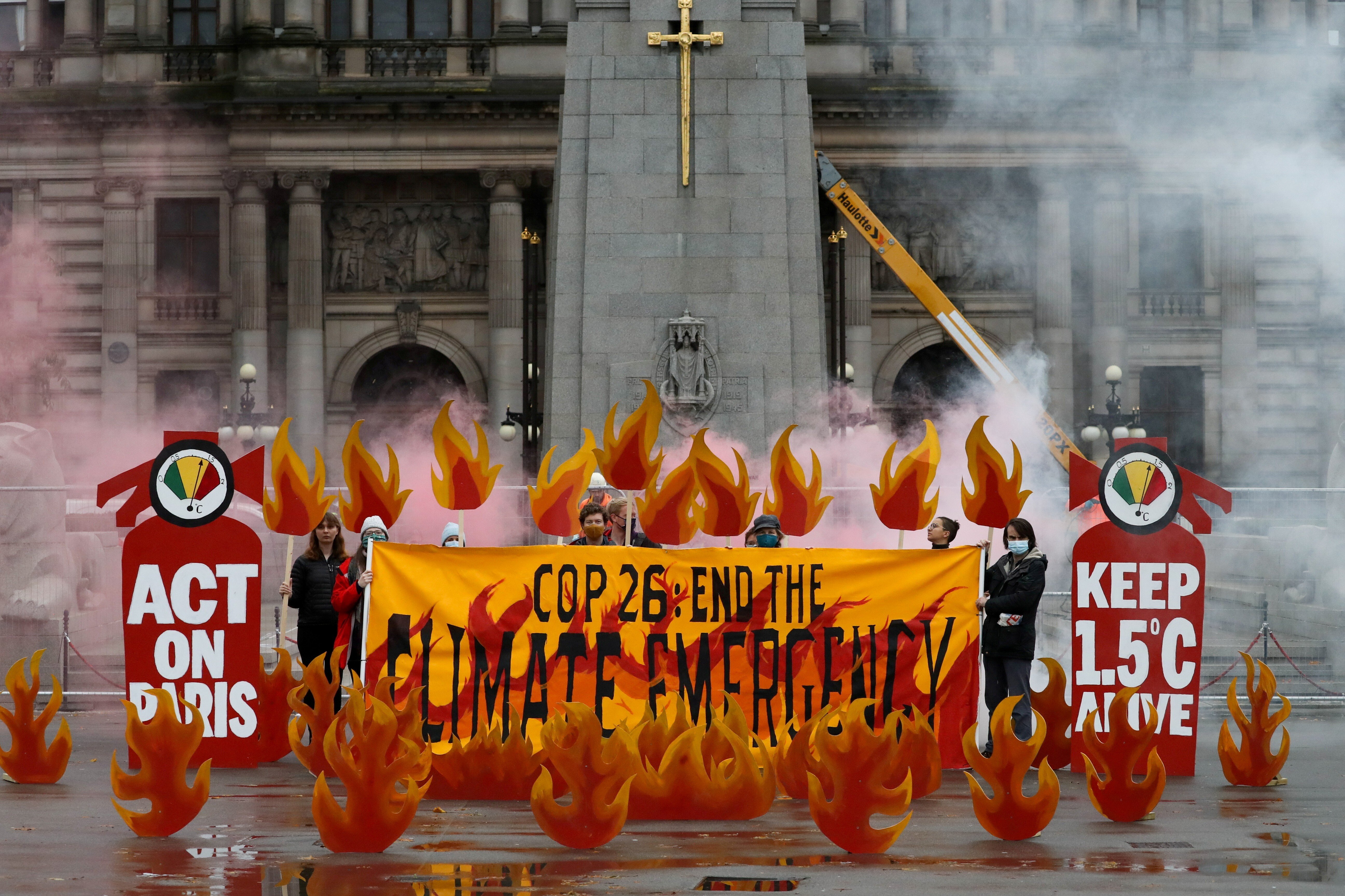 Activists symbolically set George Square on fire with an art installation ahead of the UN Climate Change Conference (COP26), in Glasgow, Scotland. Photo: Reuters