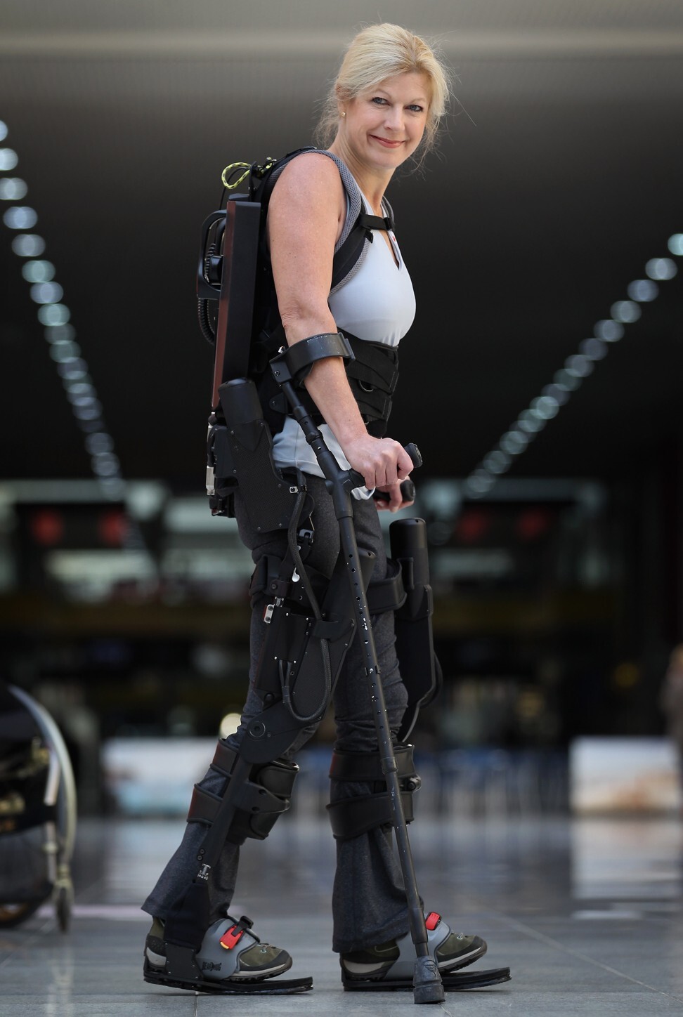 Amanda Boxtel, who is paralysed, shows off a device developed by Ekso Bionics that helps people walk. Photo: Getty Images
