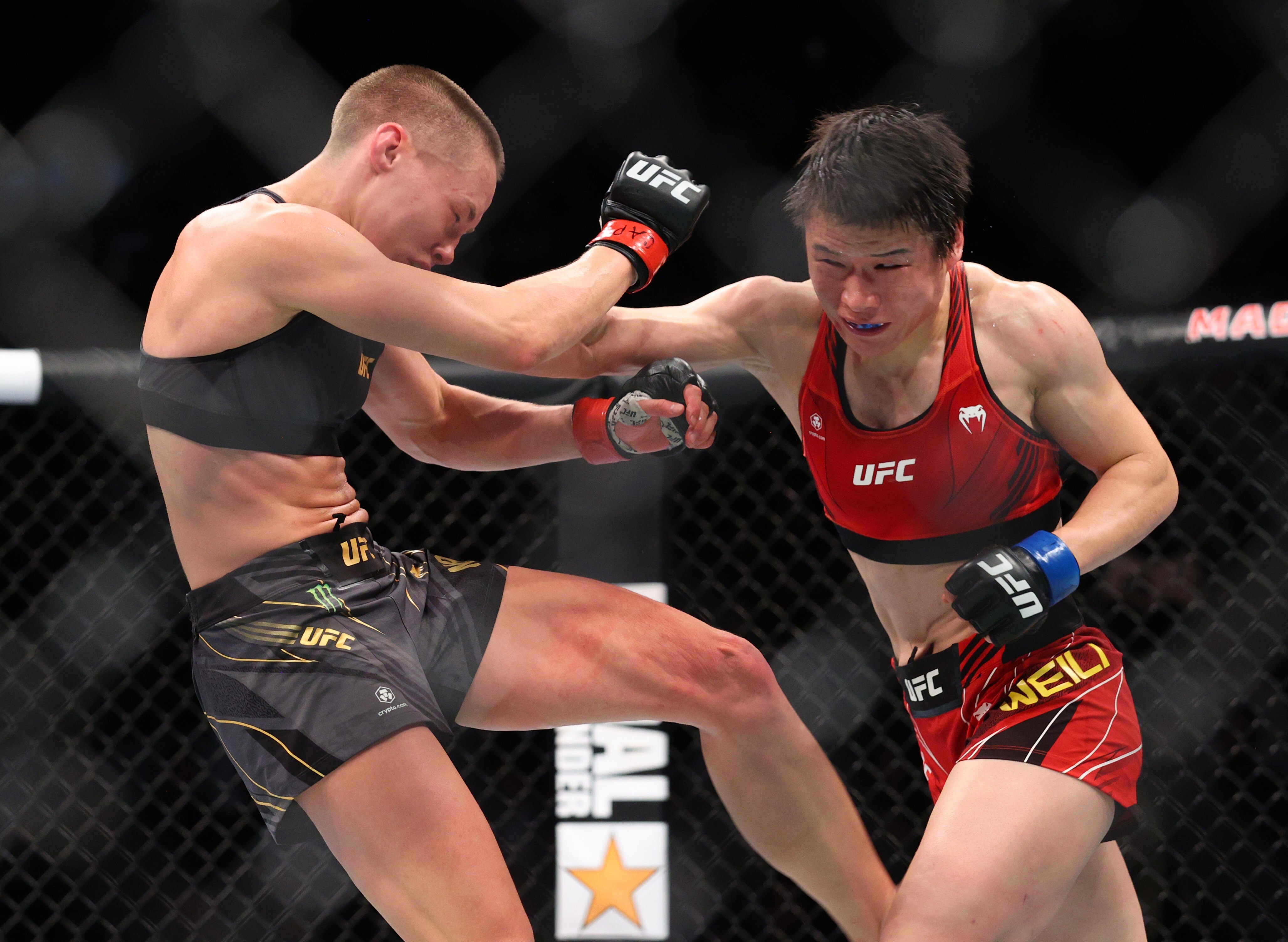 Rose Namajunas (left) throws a punch against Zhang Weili at UFC 268. Photo: USA TODAY Sports
