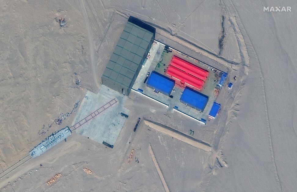 A satellite picture shows a rail terminus and target storage building in Ruoqiang, Xinjiang, China, October 7, 2021. Satellite Image: ©2021 Maxar Technologies