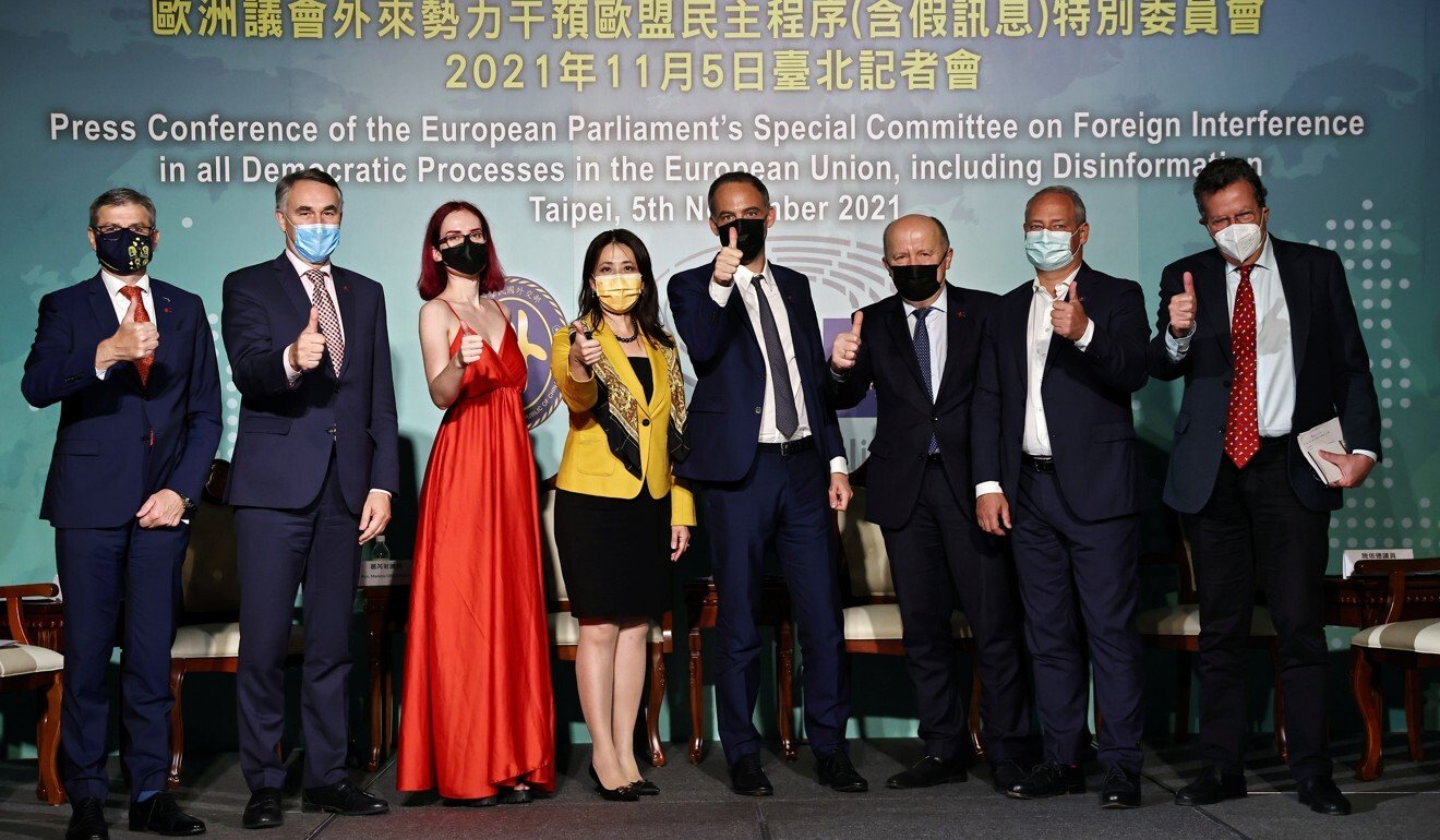 Members of the European Parliament delegation pose for a group photo with Taiwan Foreign Affairs Ministry spokesperson Joanne Ou (4th from left) at a news conference in Taipei on Friday. Photo: Reuters
