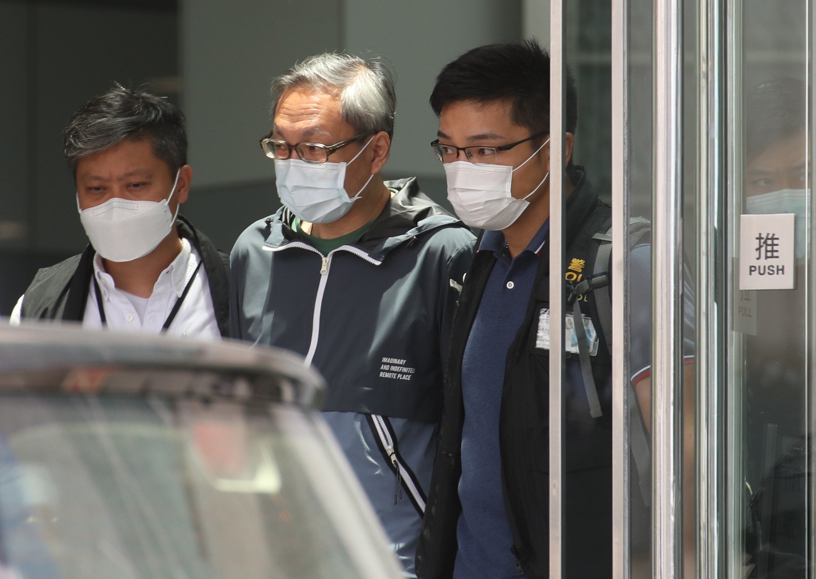 Former Apple Daily publisher Cheung Kim-hung (centre) was denied bail in his national security law trial on Friday. Photo: Winson Wong