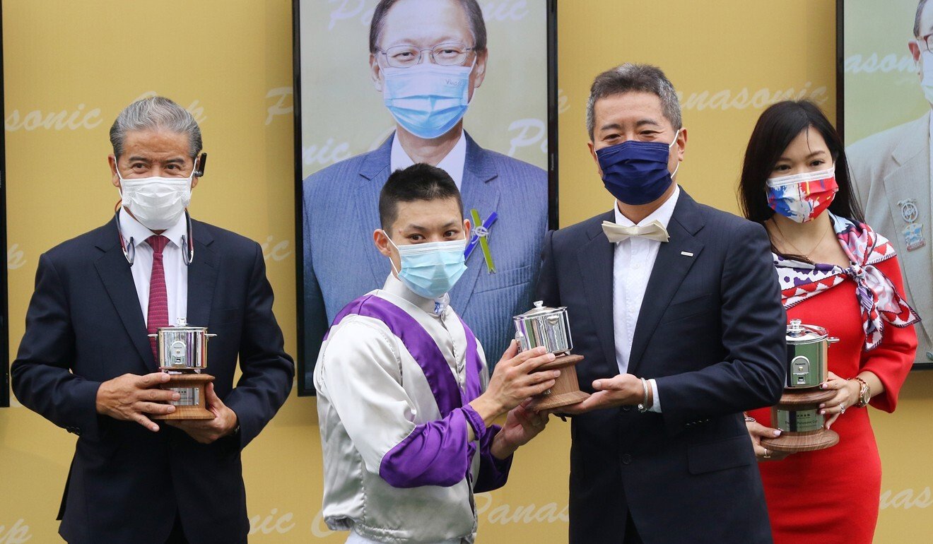 Matthew Chadwick and Tony Cruz receive their Panasonic Cup trophies last year.