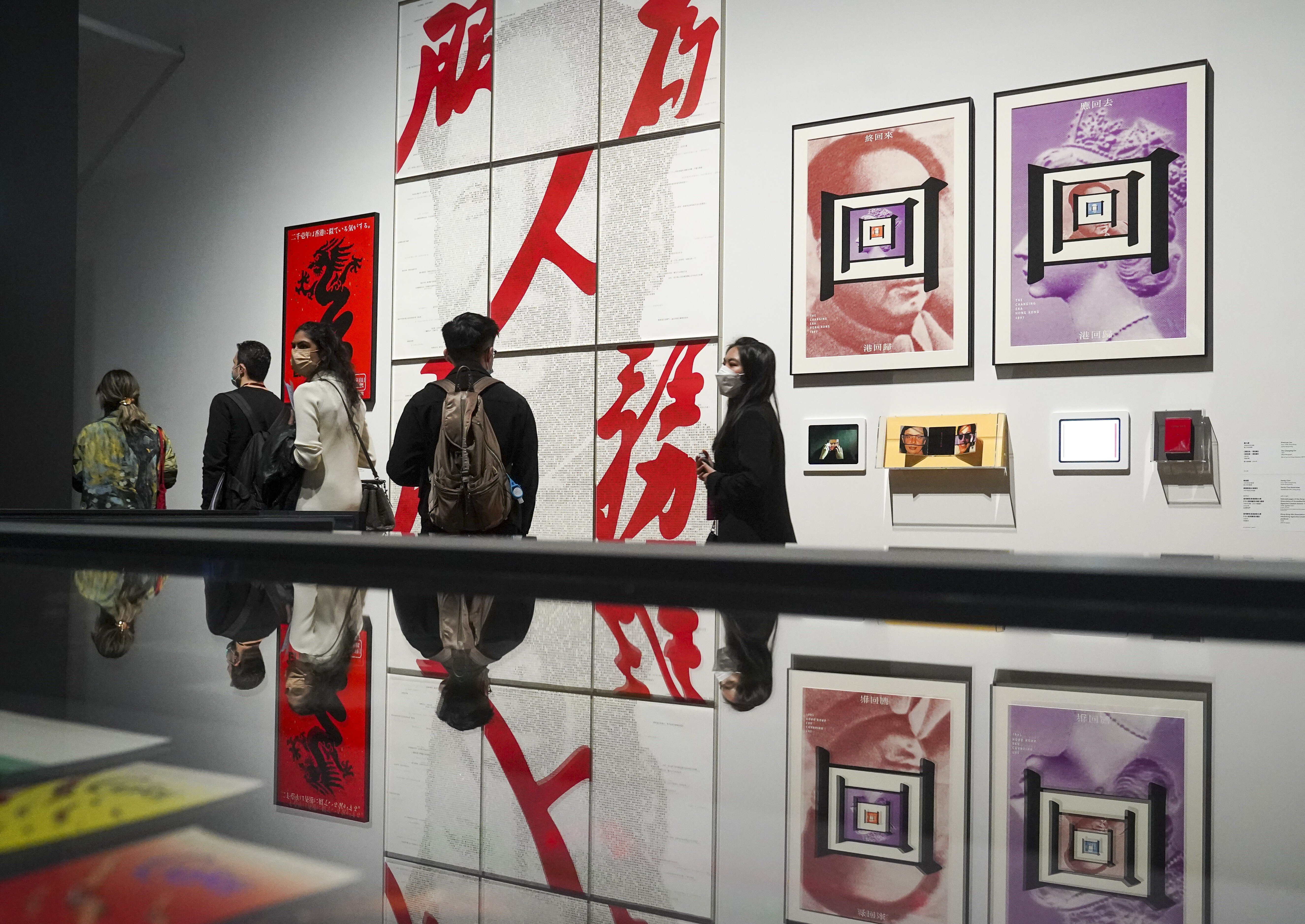 Visitors attend a media preview of the opening exhibitions at the M+ museum on Thursday. Photo: Sam Tsang