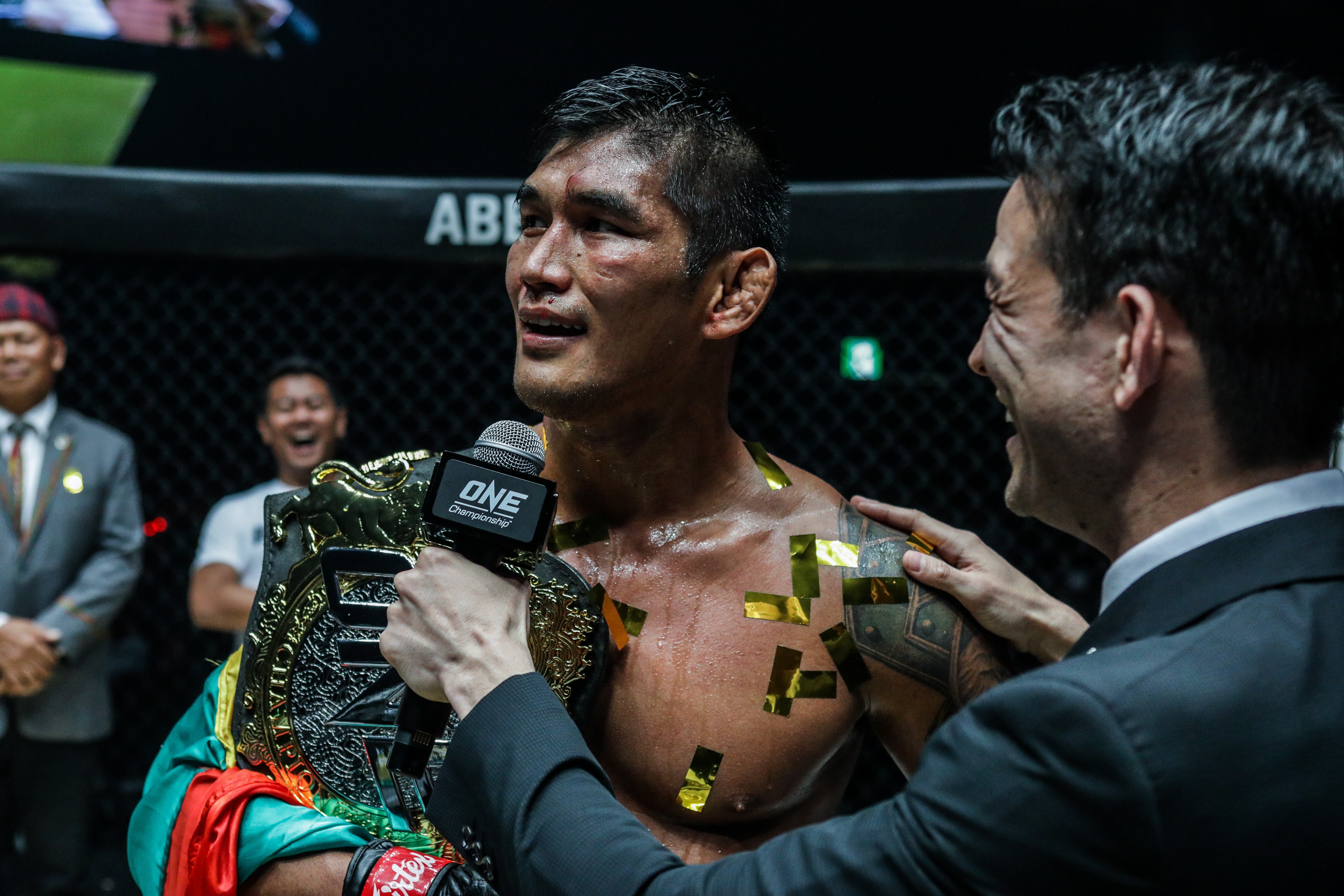 Aung La N Sang speaks to Mitch Chilson after defending his ONE light heavyweight title against Brandon Vera in Tokyo.