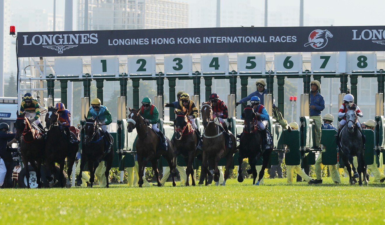 Horses leave the gates at the Hong Kong International Races.