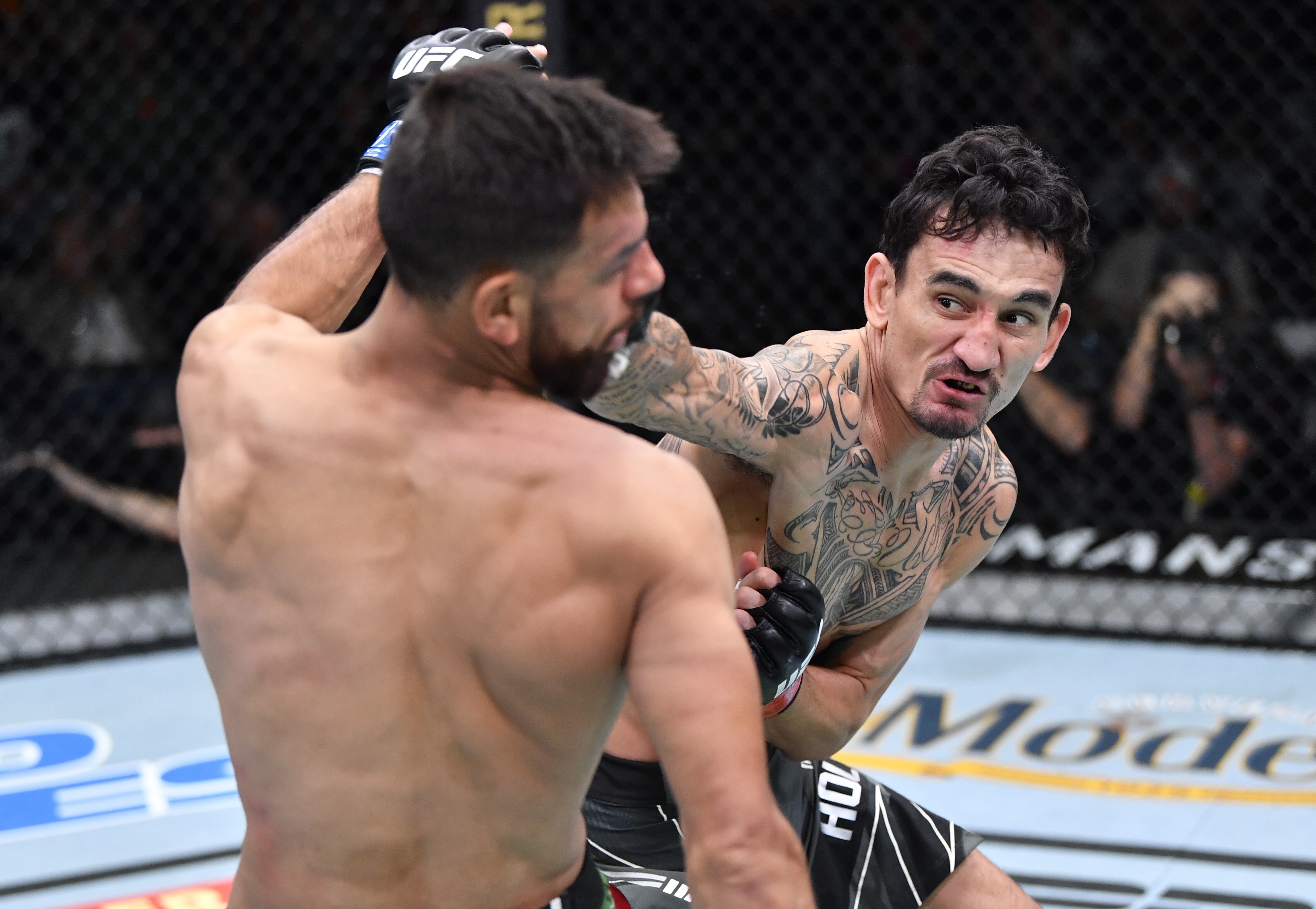 Max Holloway (right) lands a punch on Yair Rodriguez during their featherweight fight in Las Vegas. Photo: Zuffa LLC