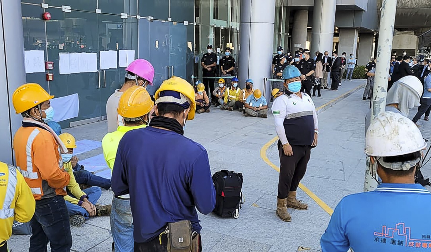 Workers at the third runway project stage a protest. Photo: Facebook