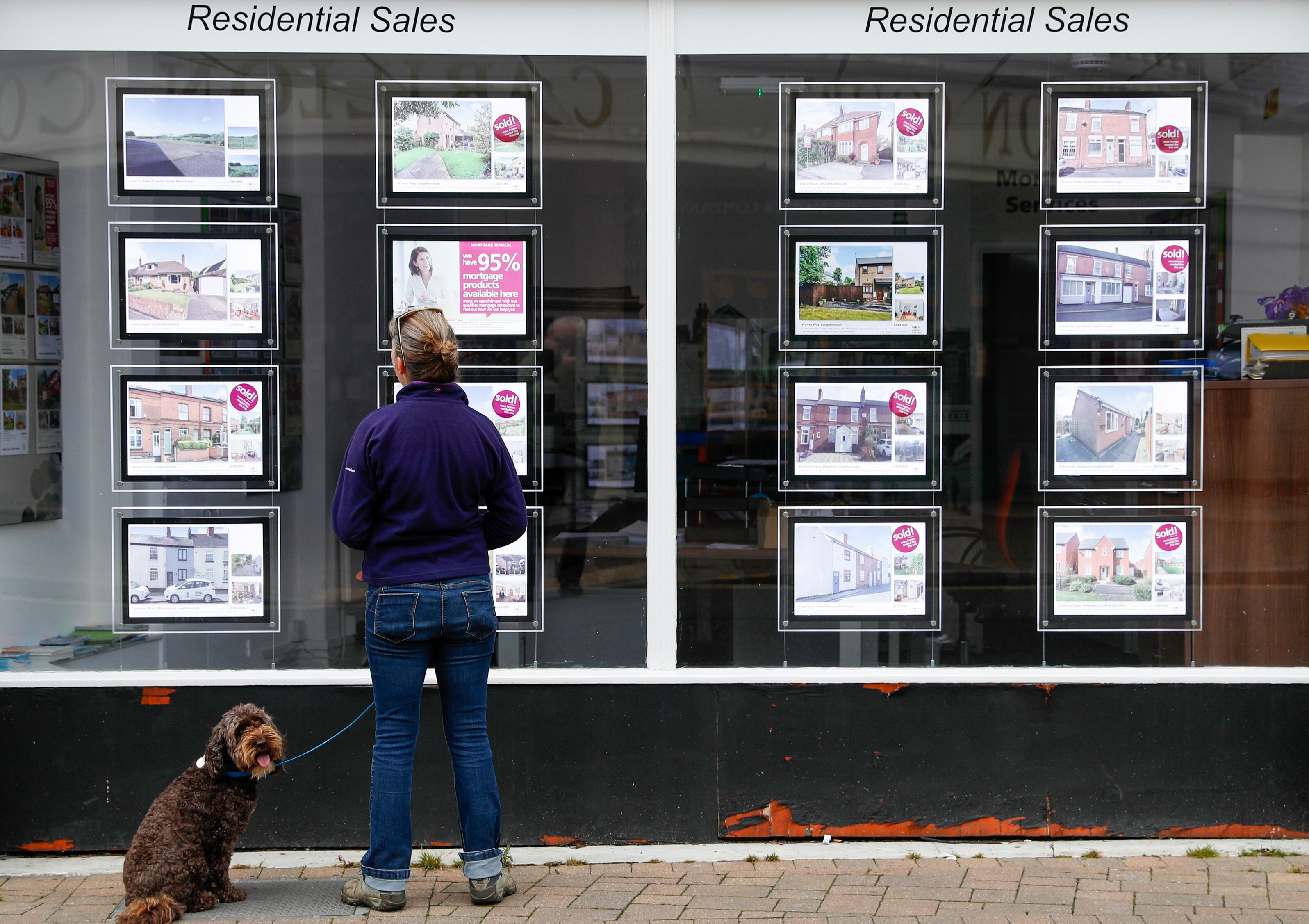 A property agent in Loughborough, UK. More than 474,000 homes were sold in the first half of the year in the UK, making it likely that they will surpass the about 818,000 homes sold in 2020. Photo: Bloomberg