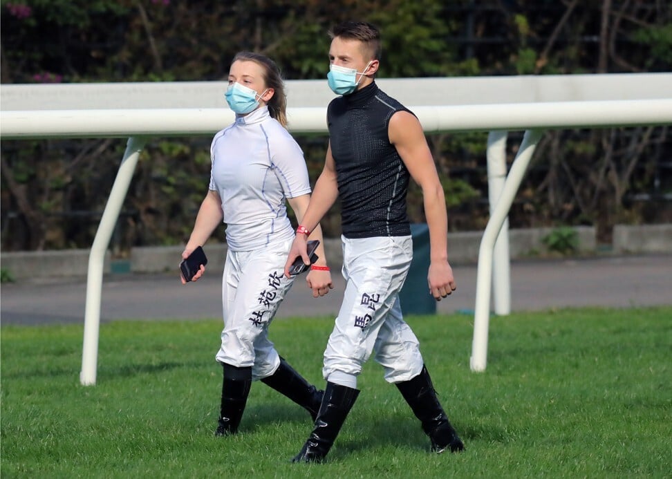 Jockeys Hollie Doyle (left) and Tom Marquand walk the turf before the IJC at Happy Valley last year.