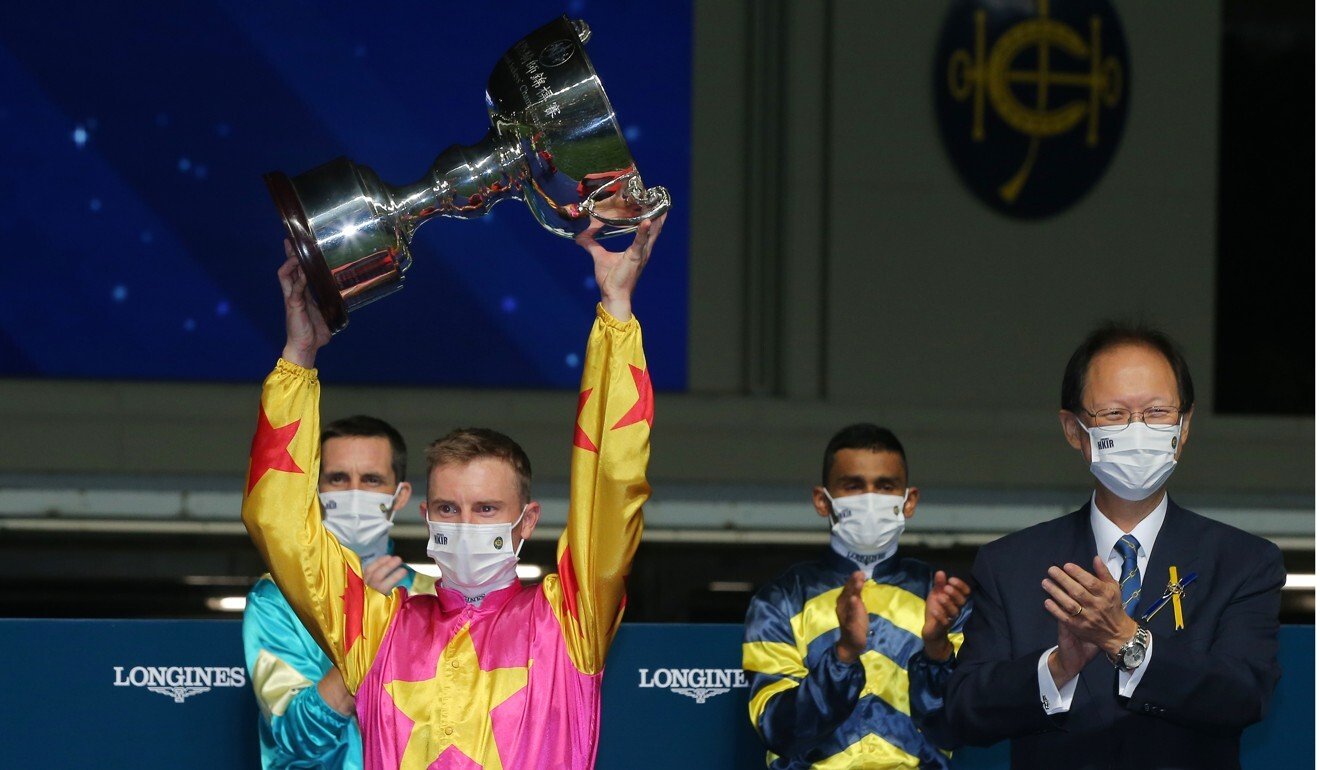 Zac Purton holds up the trophy from last year’s IJC.