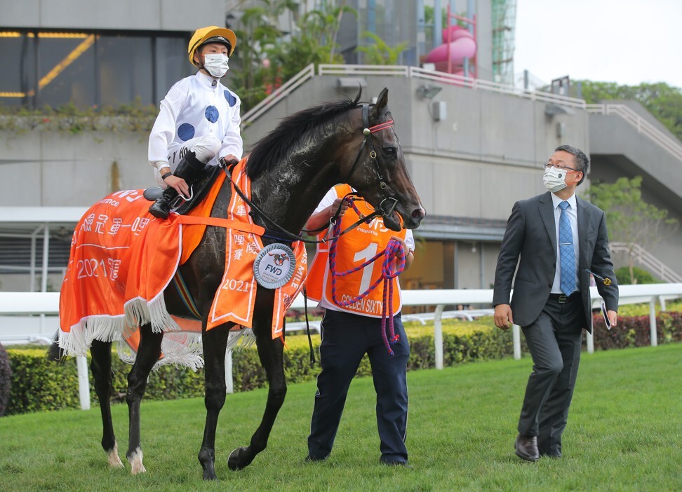 Jockey Vincent Ho and trainer Francis Lui with Golden Sixty after his Champions Mile victory.