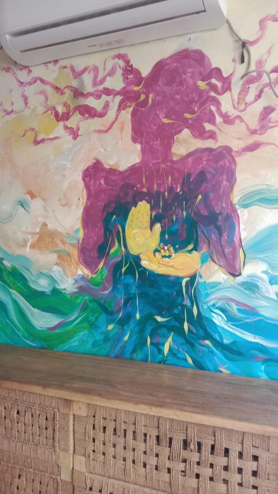 A mural of a transgender man at the salon in New Delhi. Photo: Avantika Mehta