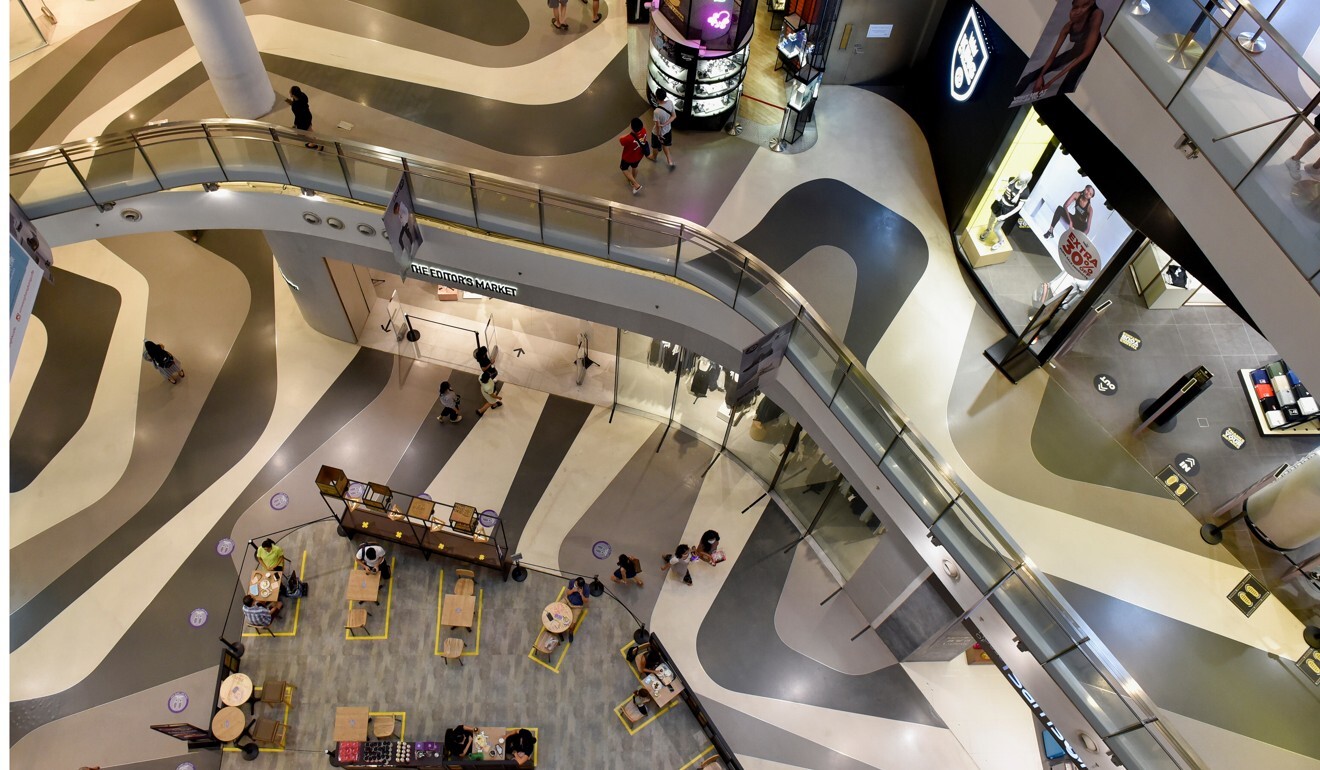 People keeping distance in a shopping centre in Singapore. Photo: Reuters