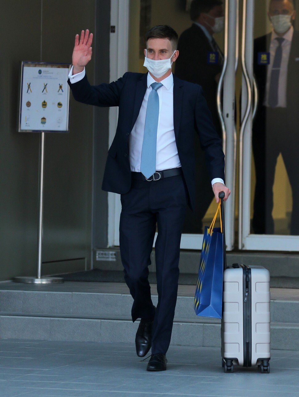 Chad Schofield waves goodbye before jetting out for Australia.