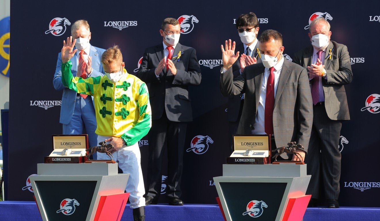 Subdued celebrations from Blake Shinn and Caspar Fownes as they accept their Hong Kong Sprint trophies.